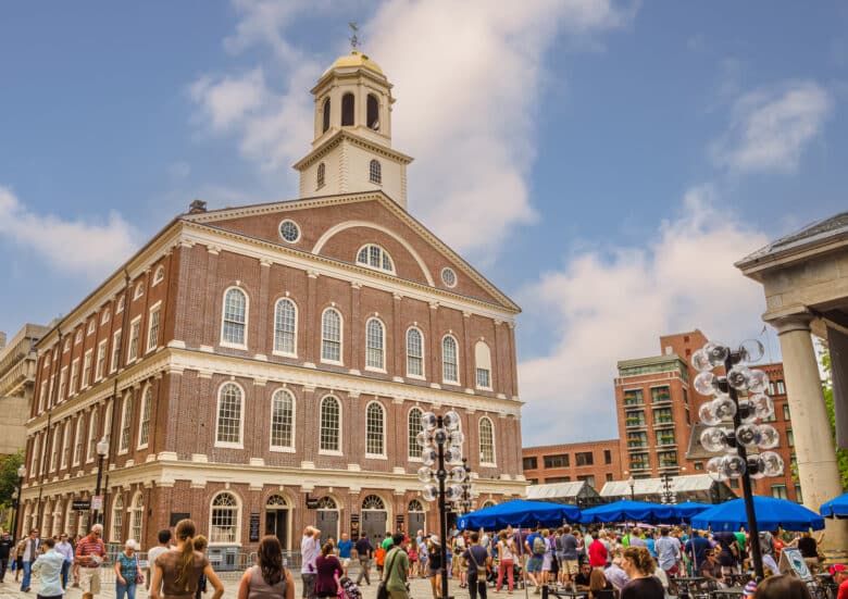 Faneuil Hall on the Freedom Trail in Boston with crowd of tourists and locals Photo Credit: DepositPhotos