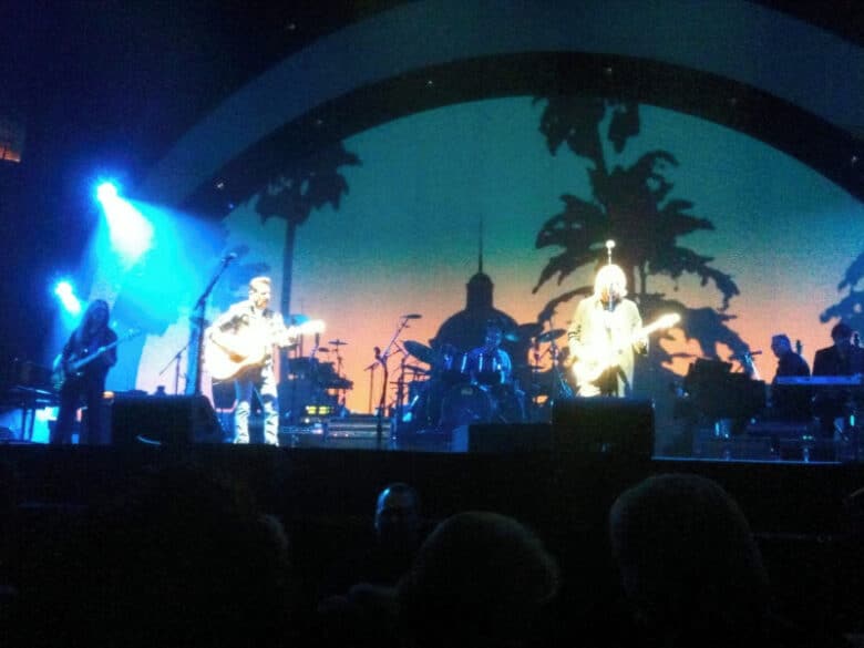Eagles performing "Hotel California" in 2010 with the image from the album cover in the background Photo Credit: Wikipedia