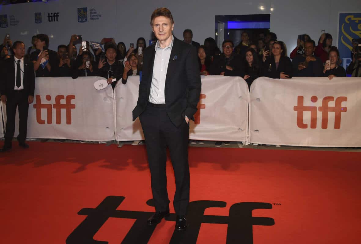 Actor Liam Neeson poses on red carpet