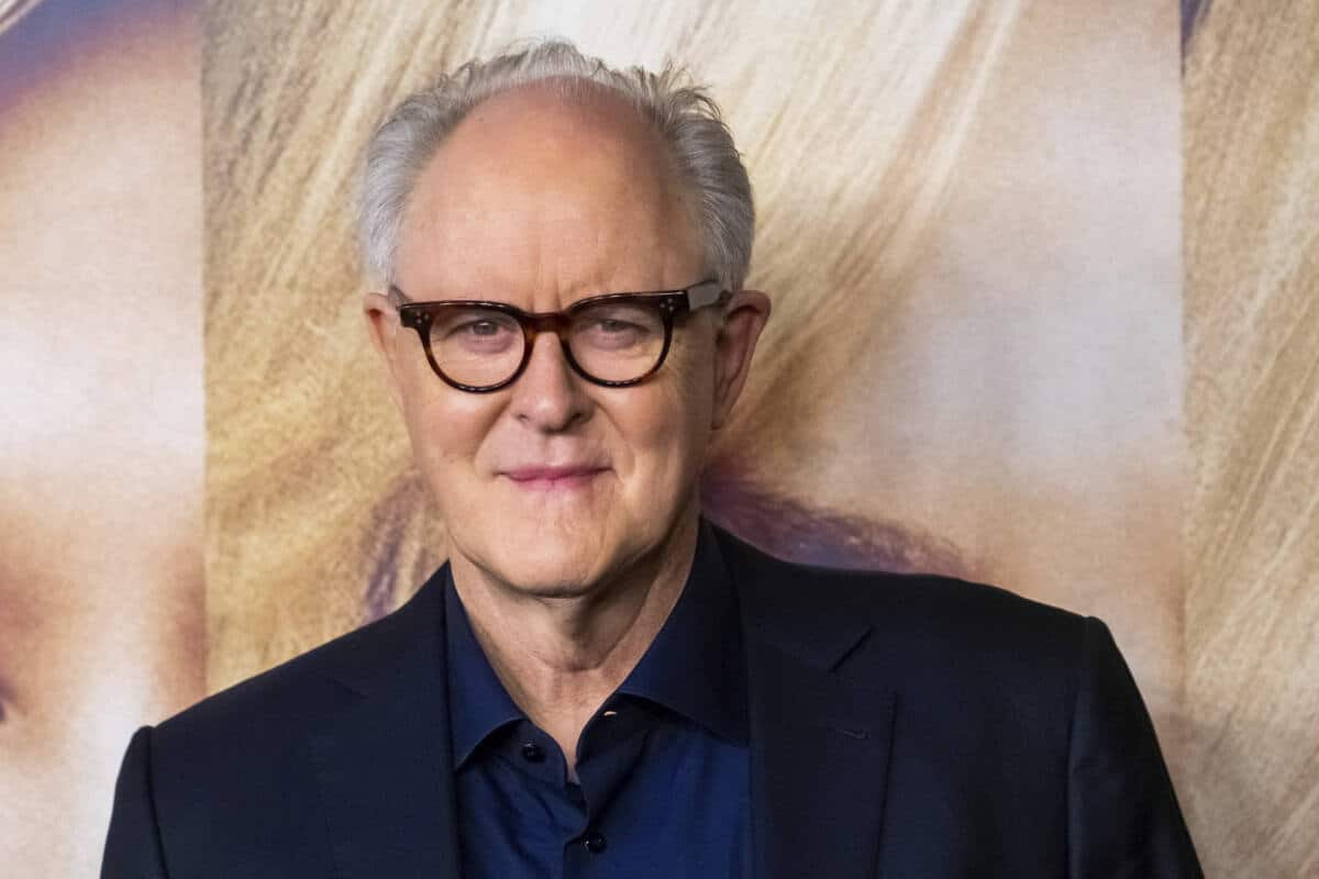 John Lithgow poses on red carpet