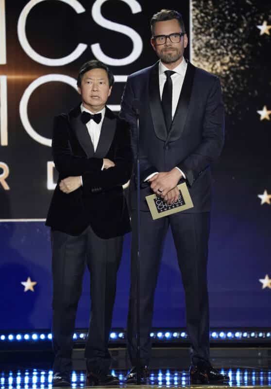 Ken Jeong and Joel McHale stand onstage at awards show