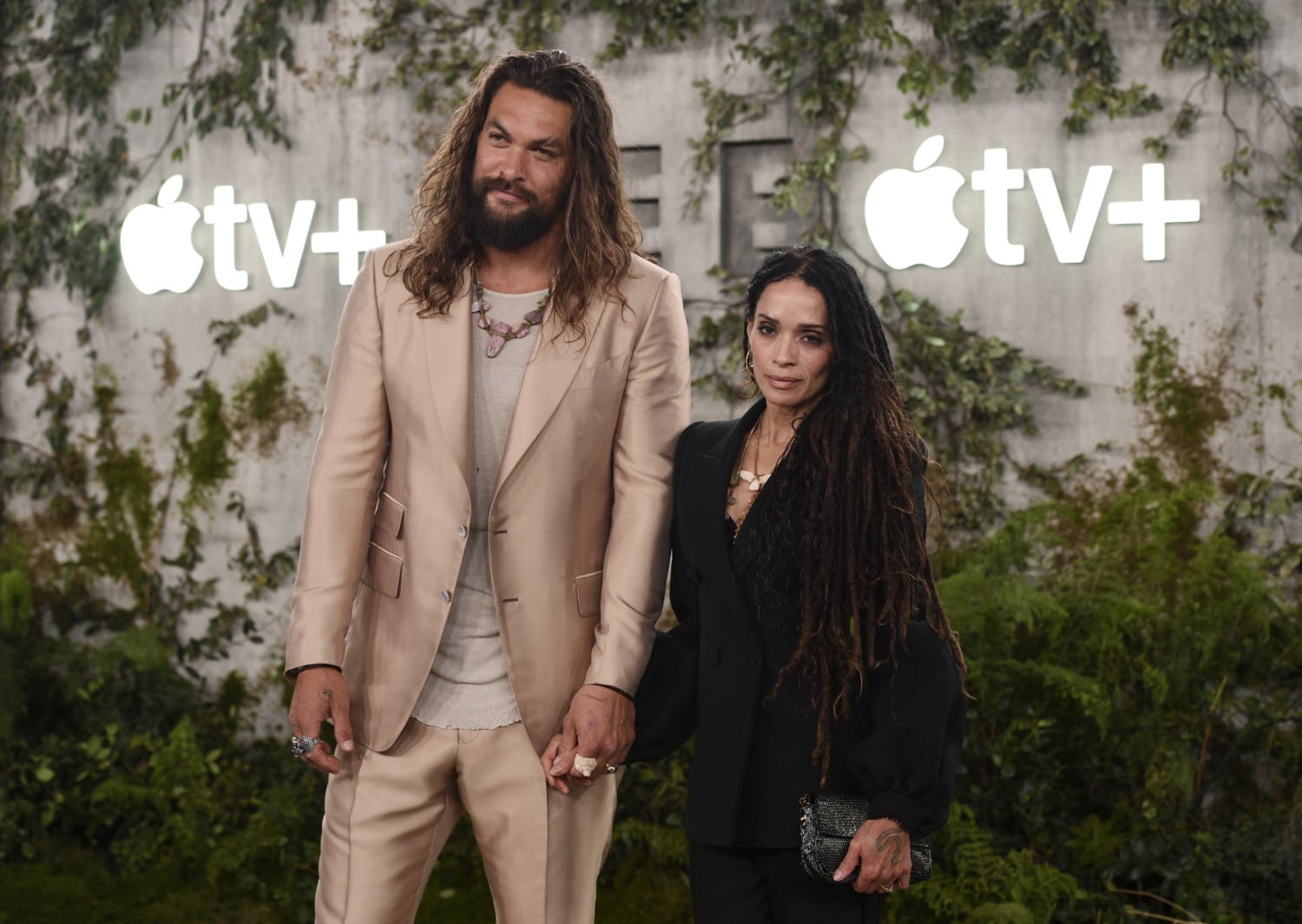 Jason Momoa and Lisa Bonet pose at event