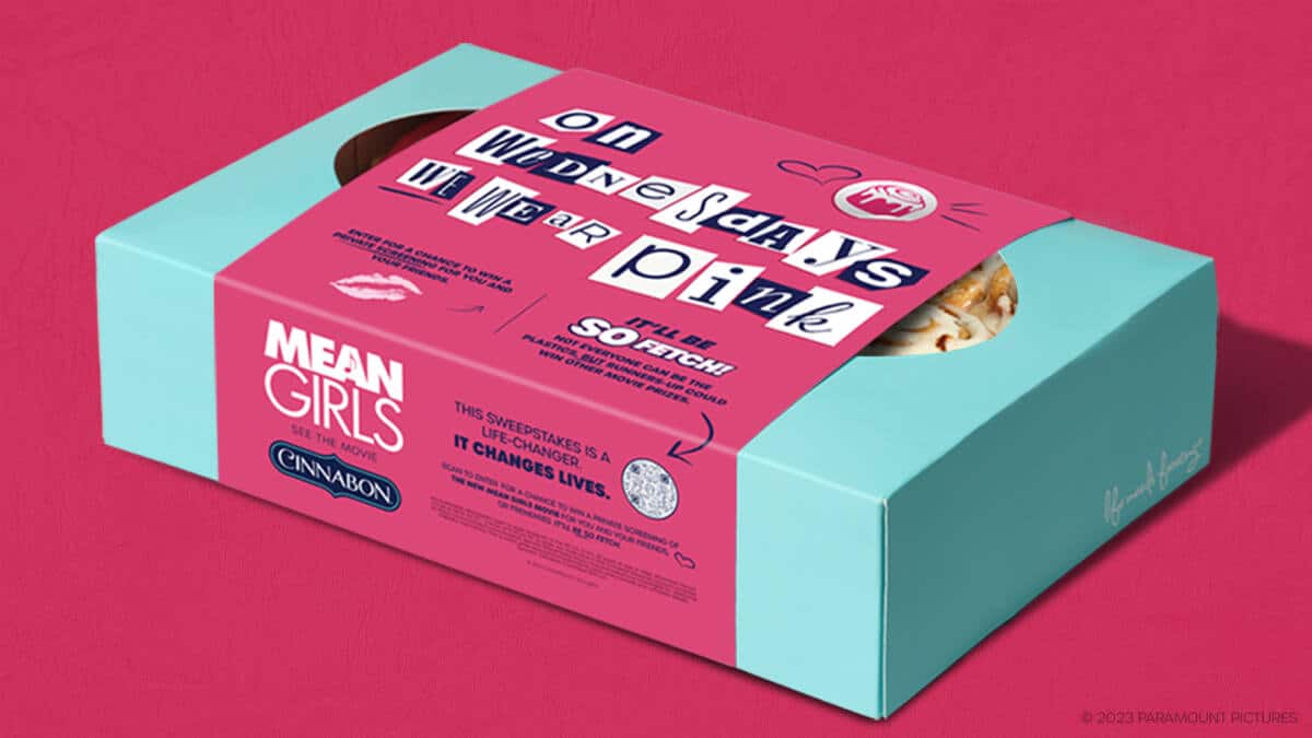 A box of Cinnabon cinnamon rolls with pink frosting to celebrate the new 