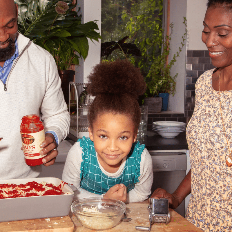 Family makes pasta dish with Rao's sauce
