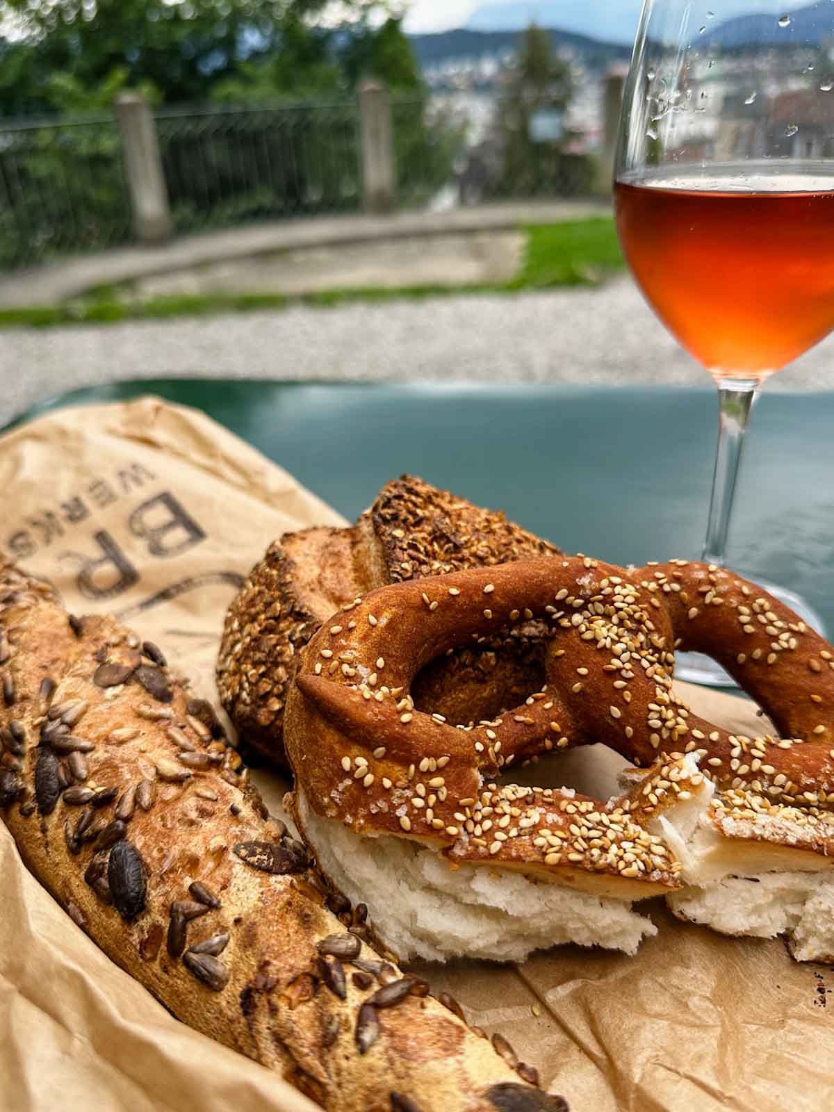 soft pretzel and bread with a glass of Rose.