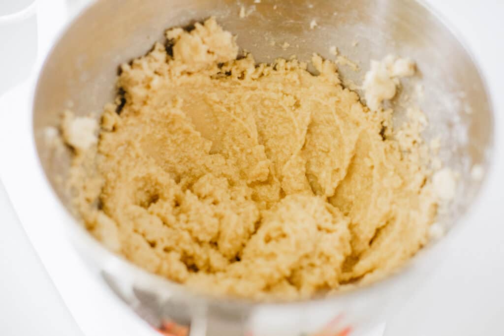 Mixing bowl with creamed butter and sugars. 