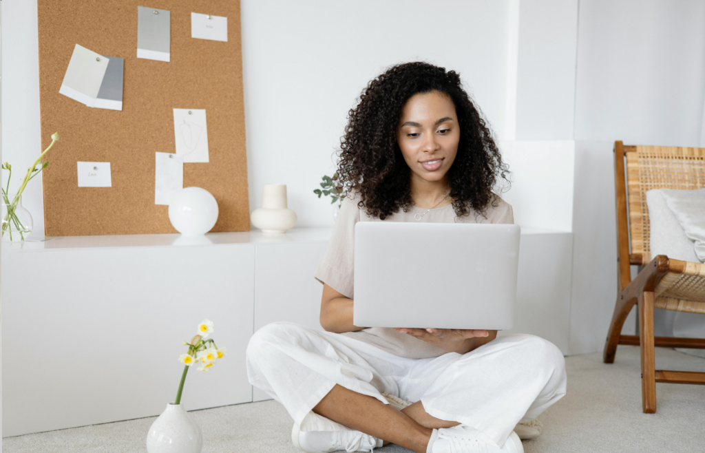 A person updating their resume on a laptop