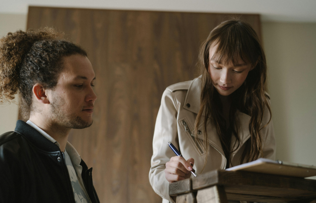A professional signing a document