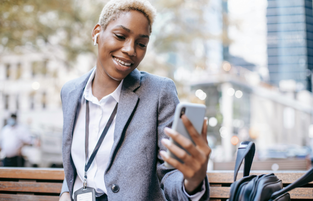 A young ethnic female scrolling on their phone 