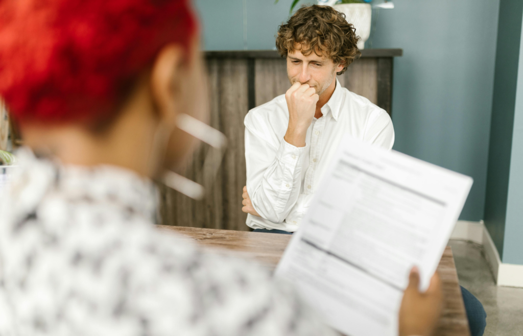 A woman holding resume jobs highlighted 