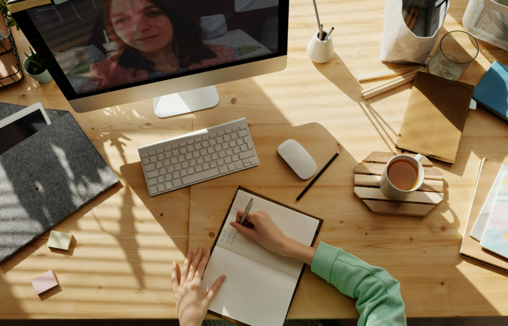A young person at a desk and learning 
 online 
