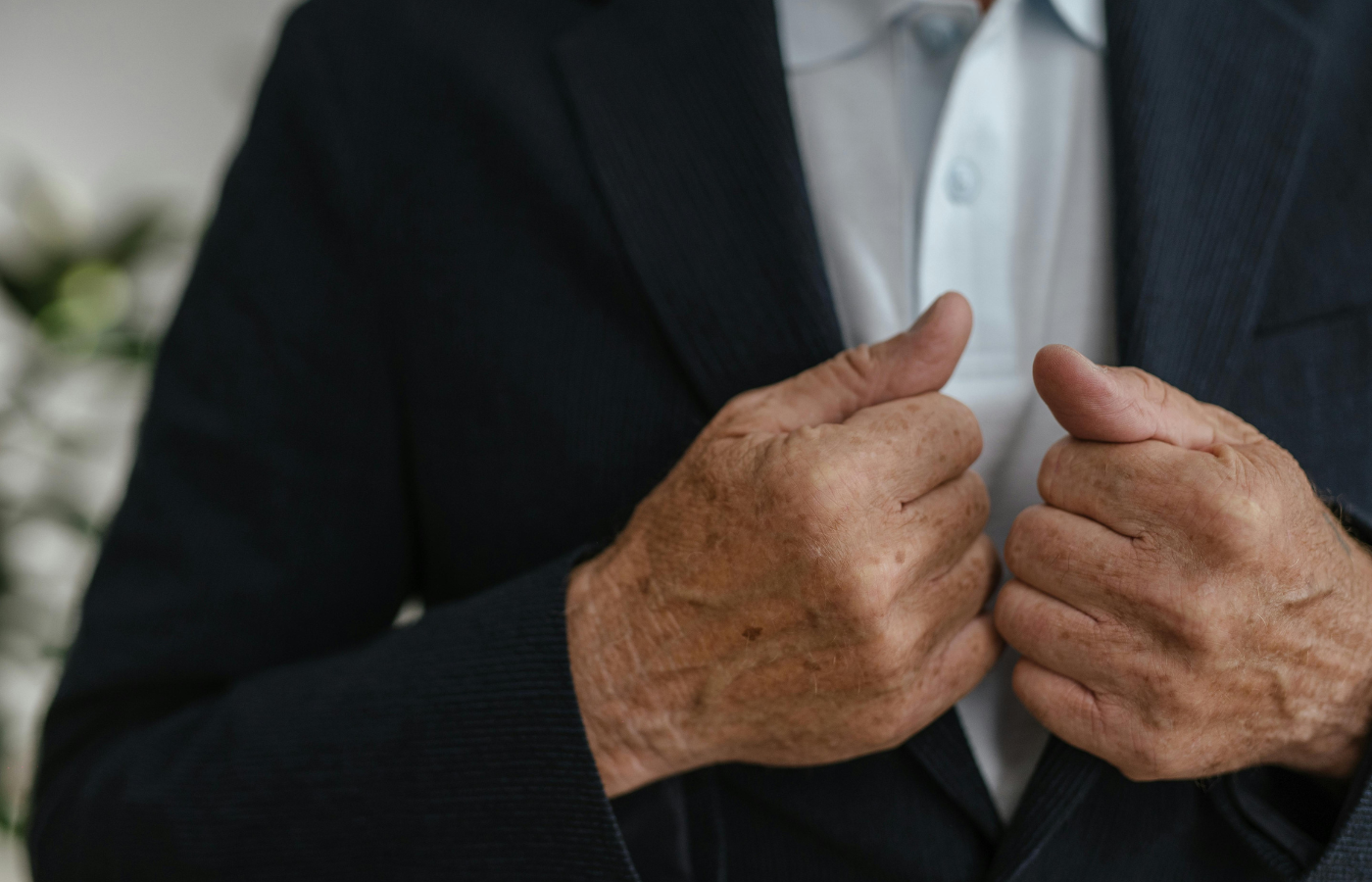 Man Fixing his Suit Jacket