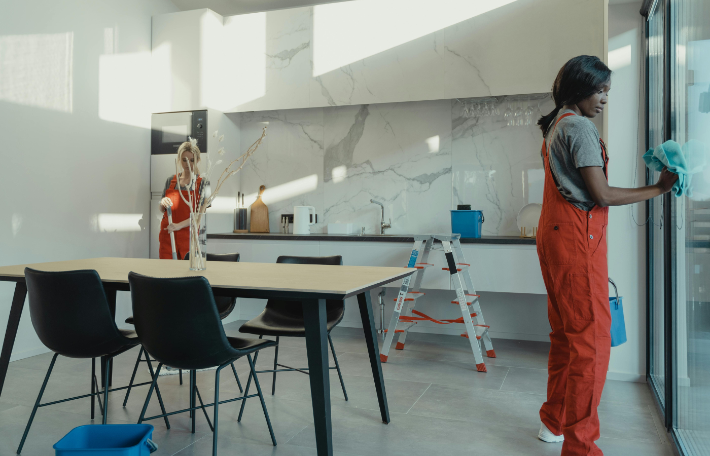 A professional cleaner Women Working in a kitchen counter
