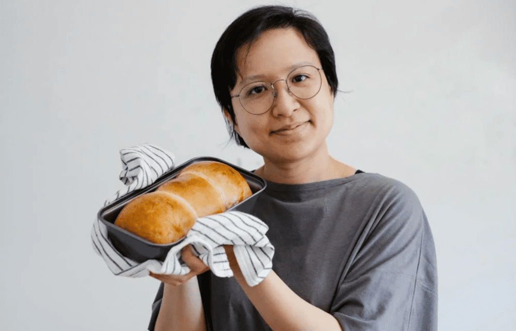 woman holding bread