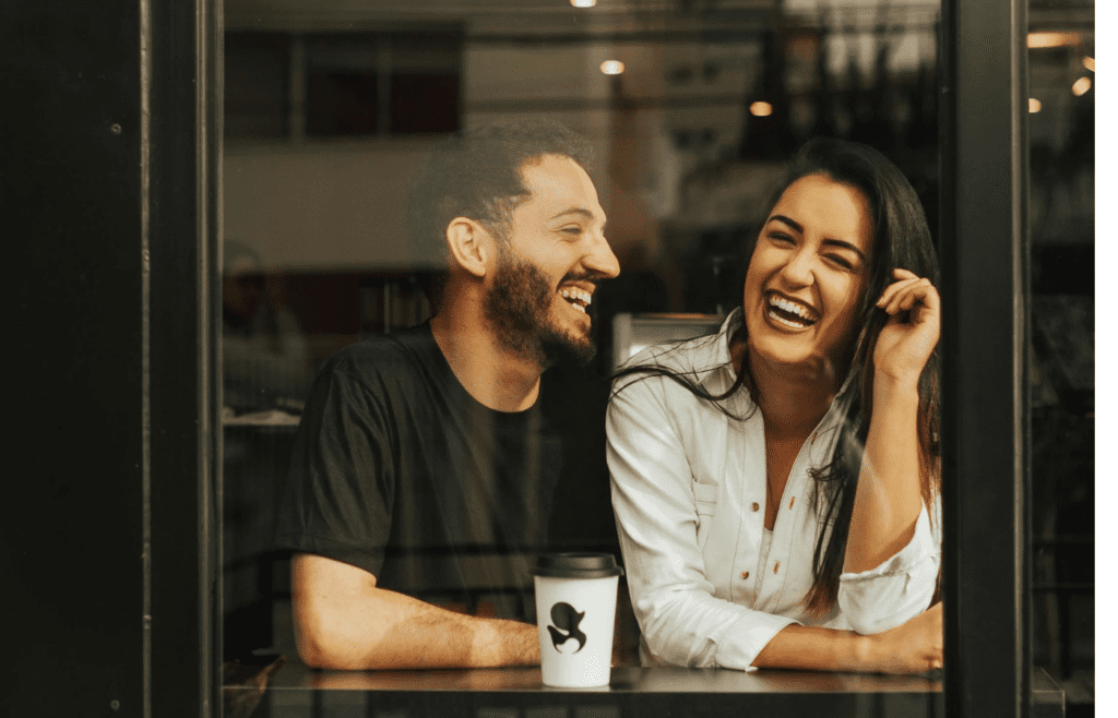 man and woman laughing
