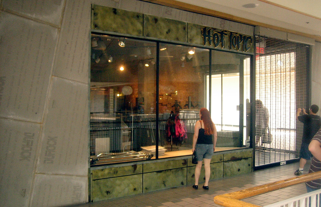 Customer outside Hot Topic store inside a mall