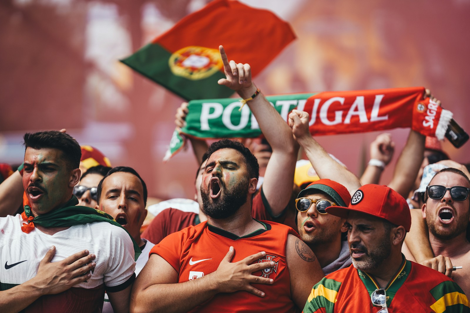 A group of people holding up signs and flags