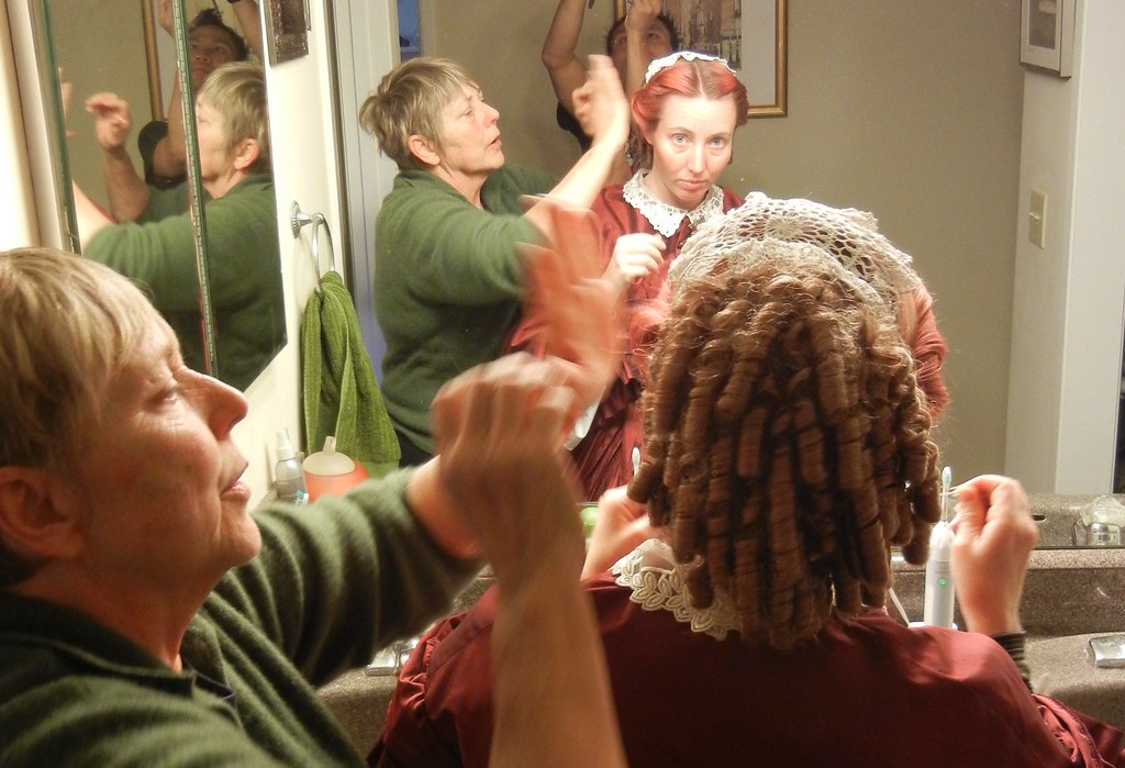 Pinning in the Victorian-style hairpiece